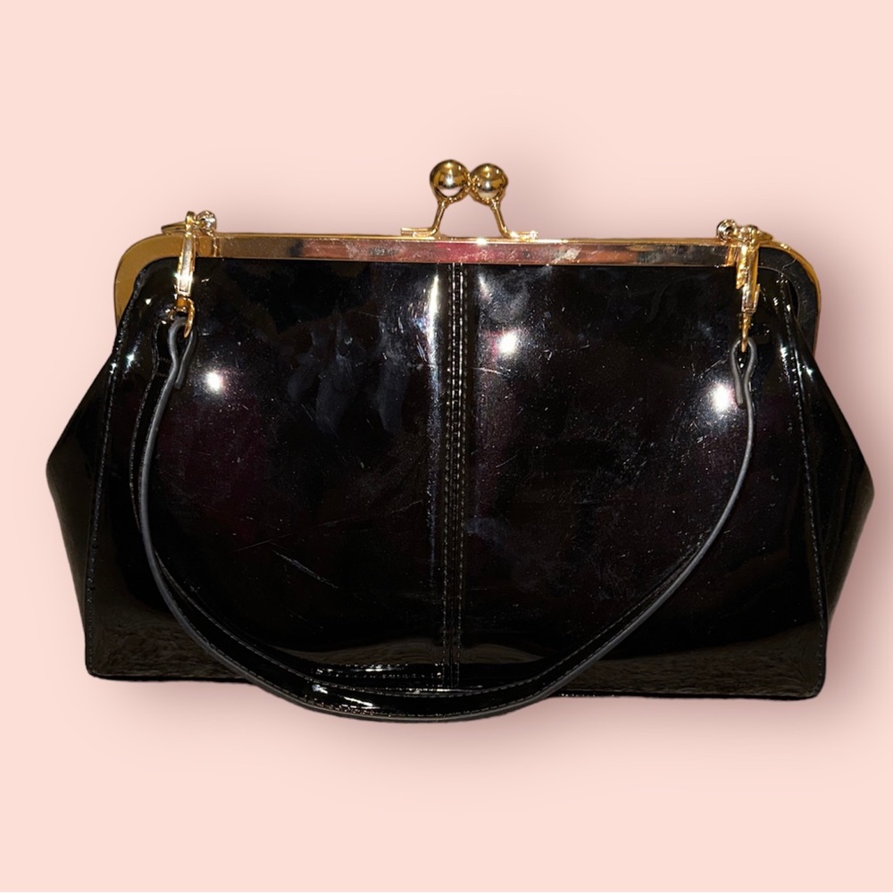 Black faux leather gold clam shut style purse with chain strap included NEW